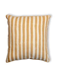 Striped pillow with yellow and white stripes on a white background
