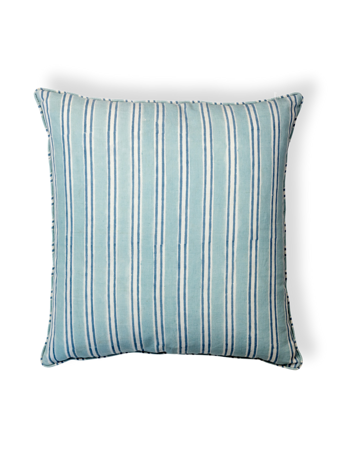 Striped blue pillow on a white background
