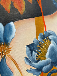 Close-up of a fabric with blue floral embroidery on a beige background