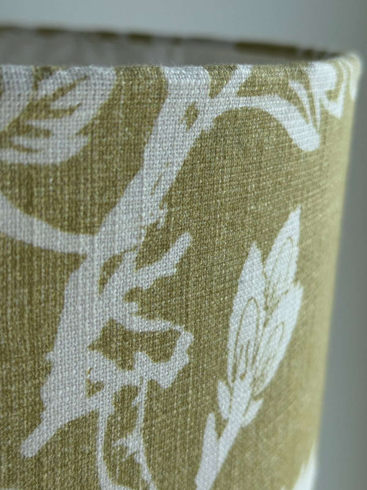 Close-up of a fabric with a floral pattern on a green background