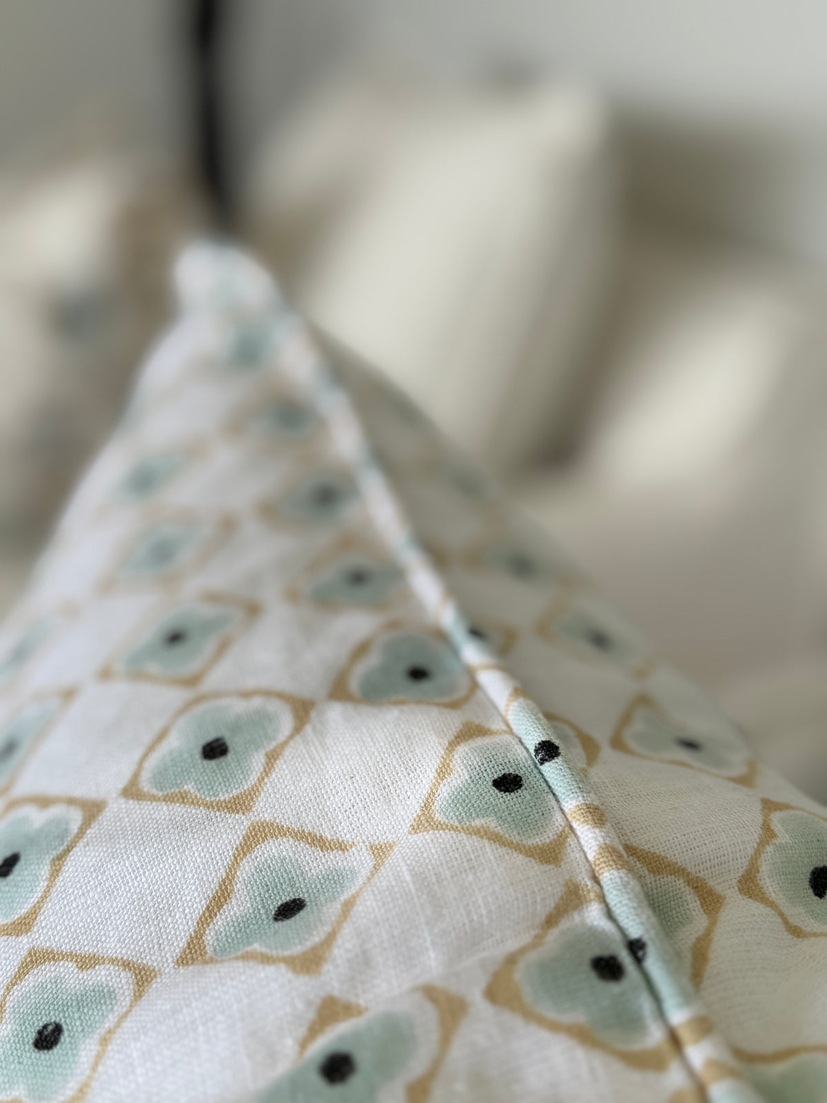 Close-up of fabric with a geometric pattern on a blurred background