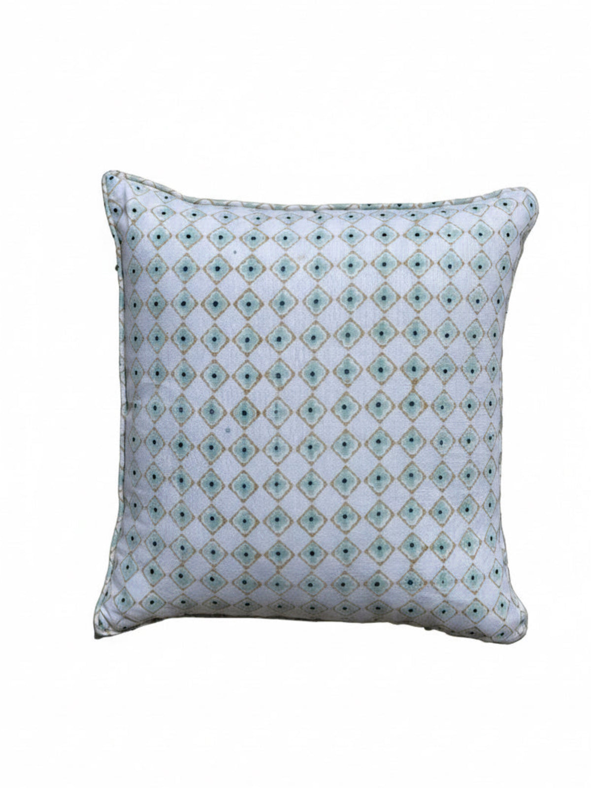 Decorative pillow with geometric pattern on a tiled floor