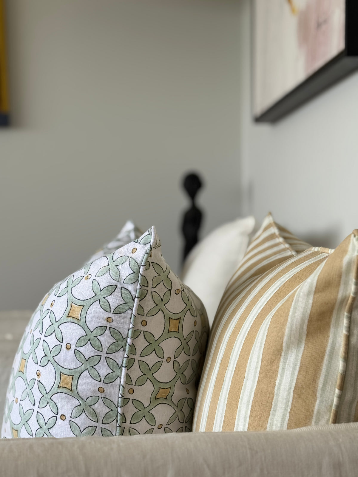 Decorative pillows on a sofa with a blurred background