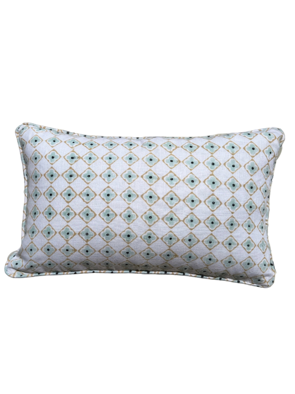 Decorative pillow on a patterned tiled floor