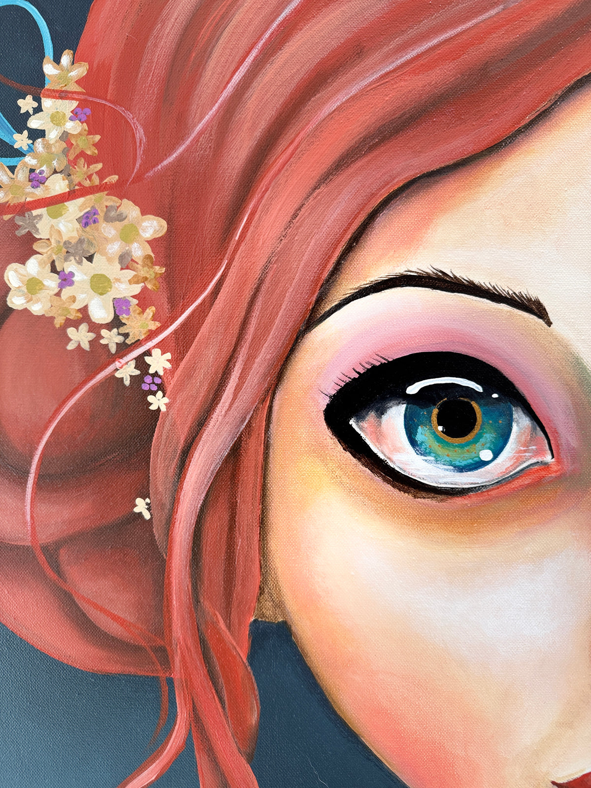 Close-up of a person's eye with pink hair and flowers, on a dark background