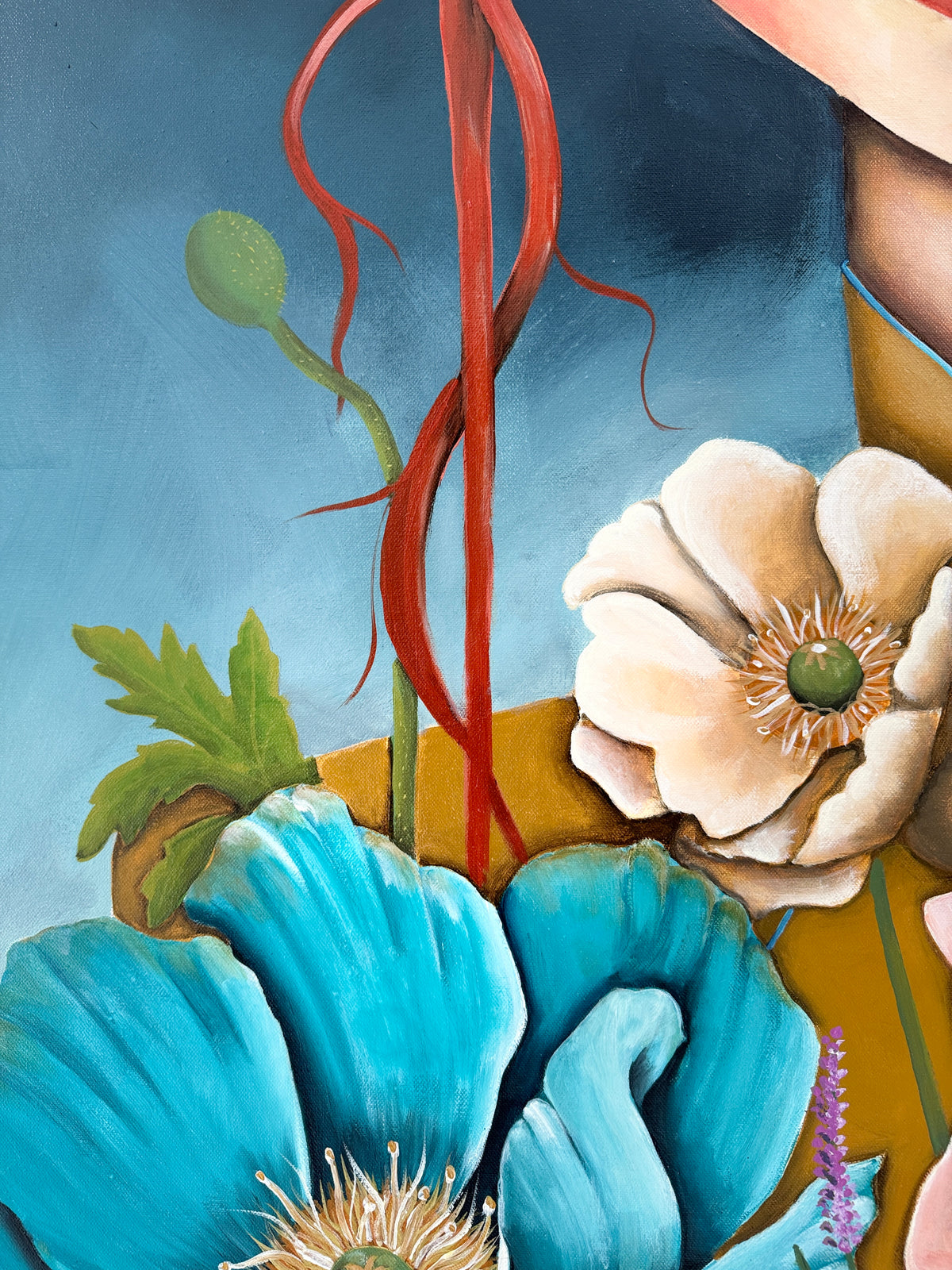 Close-up of a painting with blue and beige flowers on a blue background