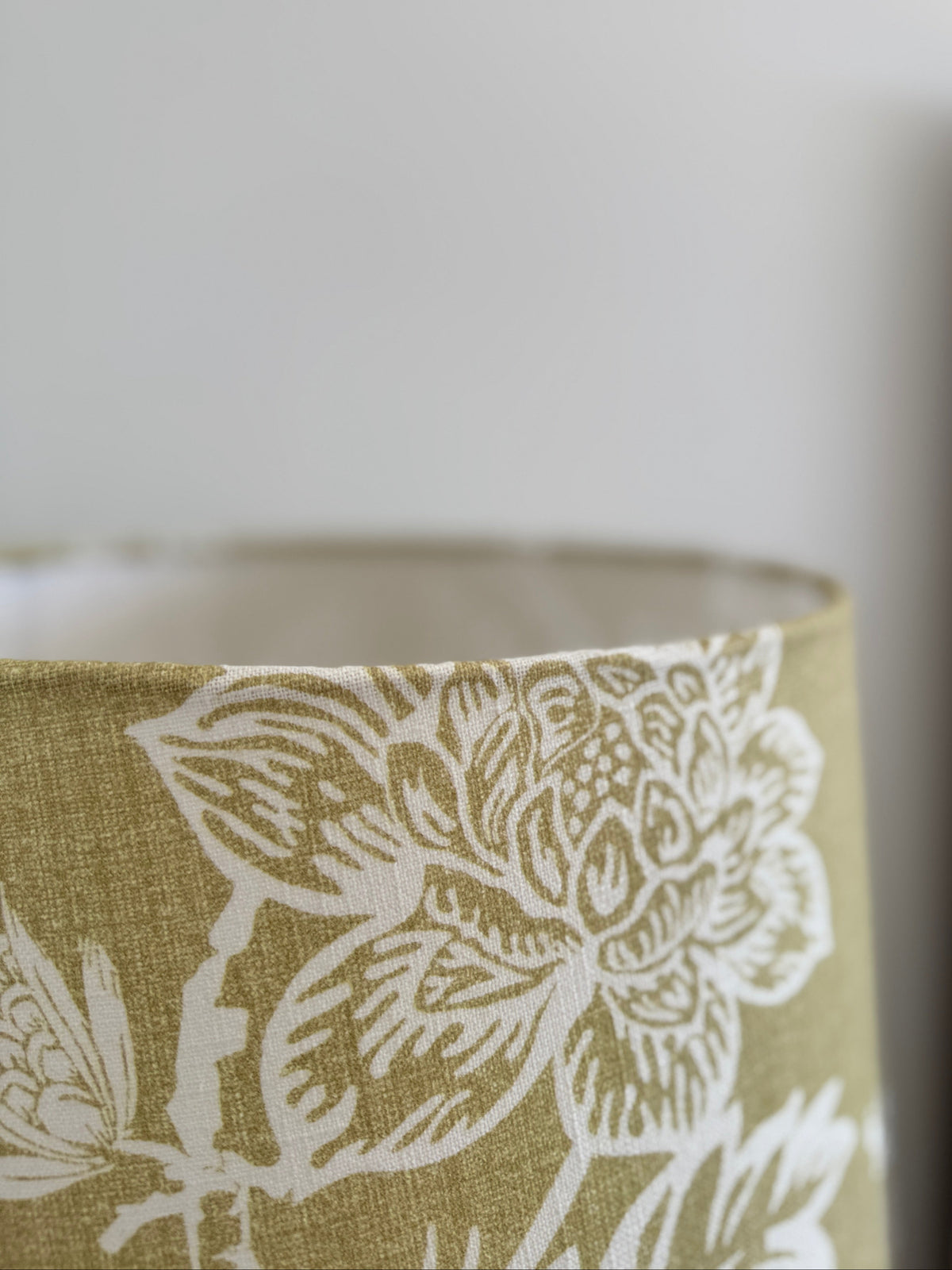 Close-up of a floral-patterned fabric with a neutral background