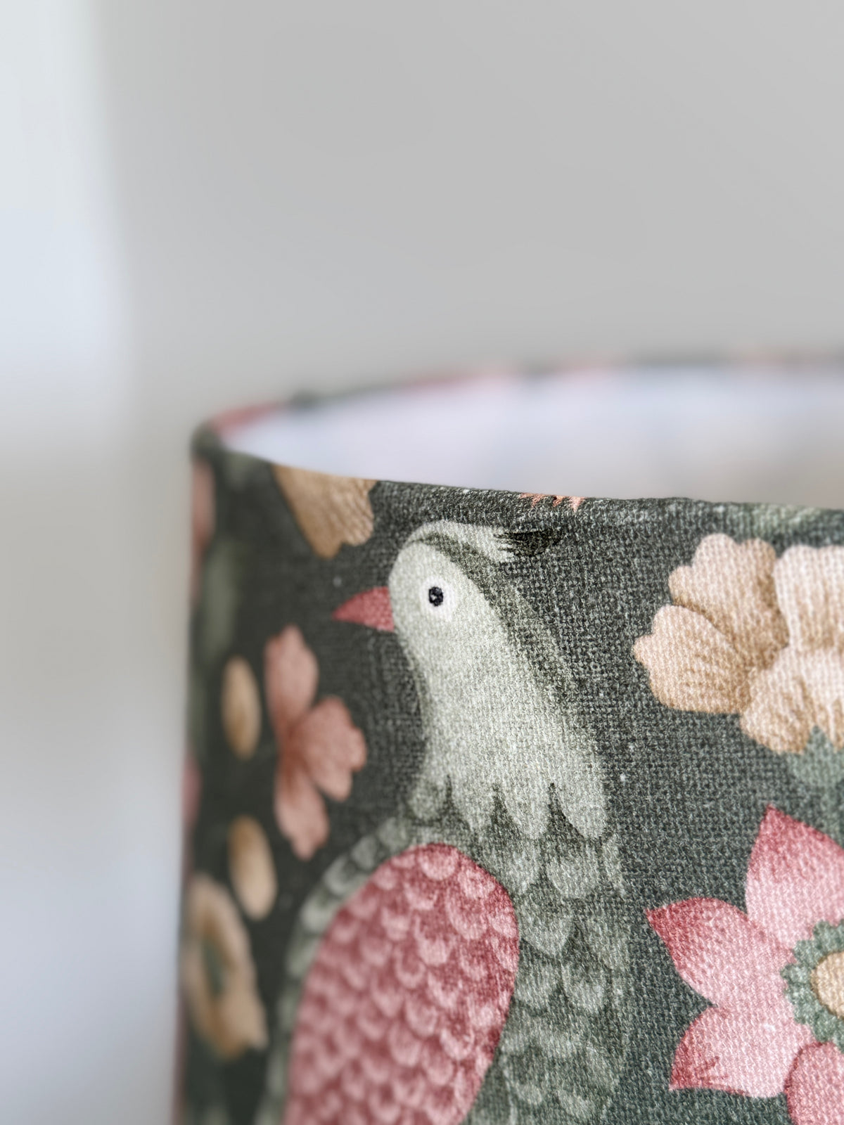 Fabric with floral and bird pattern on a dark background