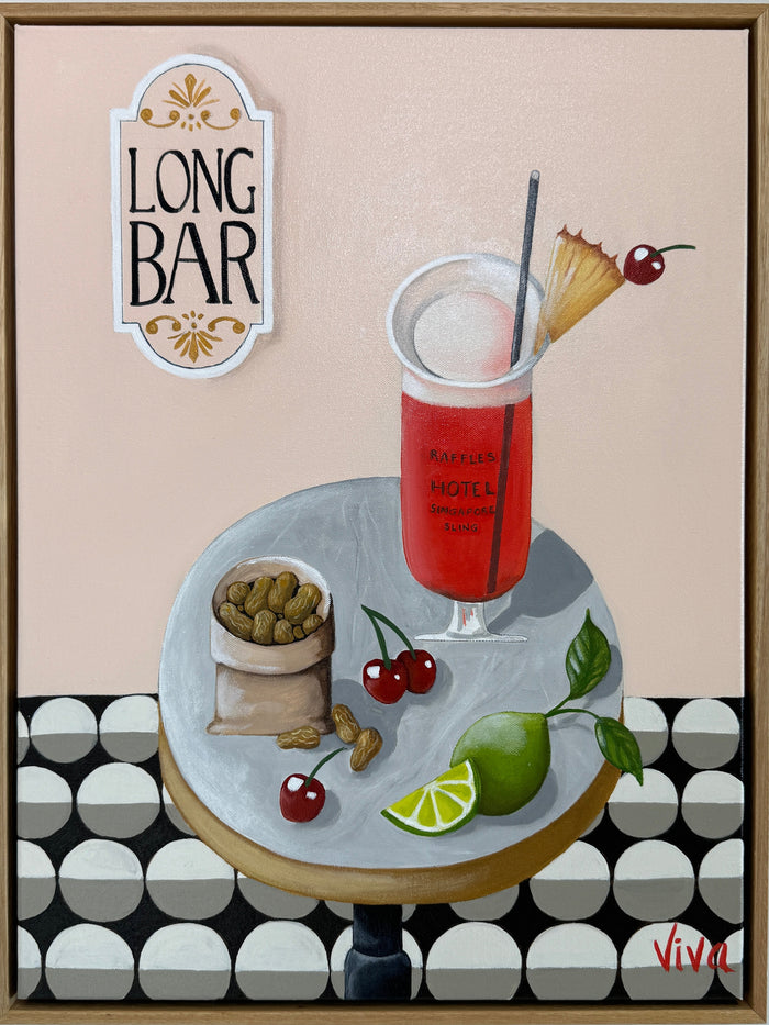 Framed artwork of a cocktail with garnishes on a patterned background