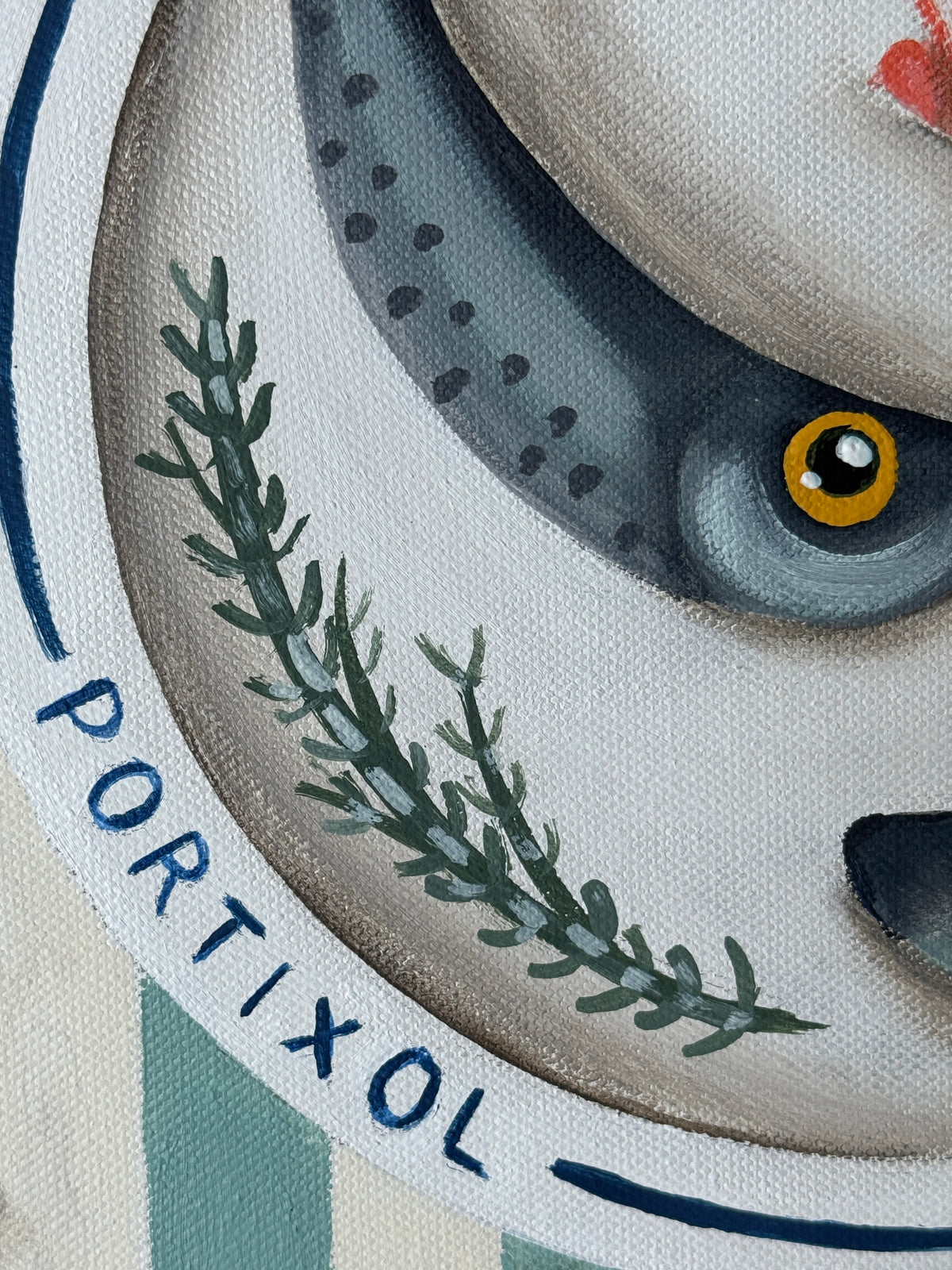Close-up of a cat's face with a brand name 'Portixol' on a circular object.