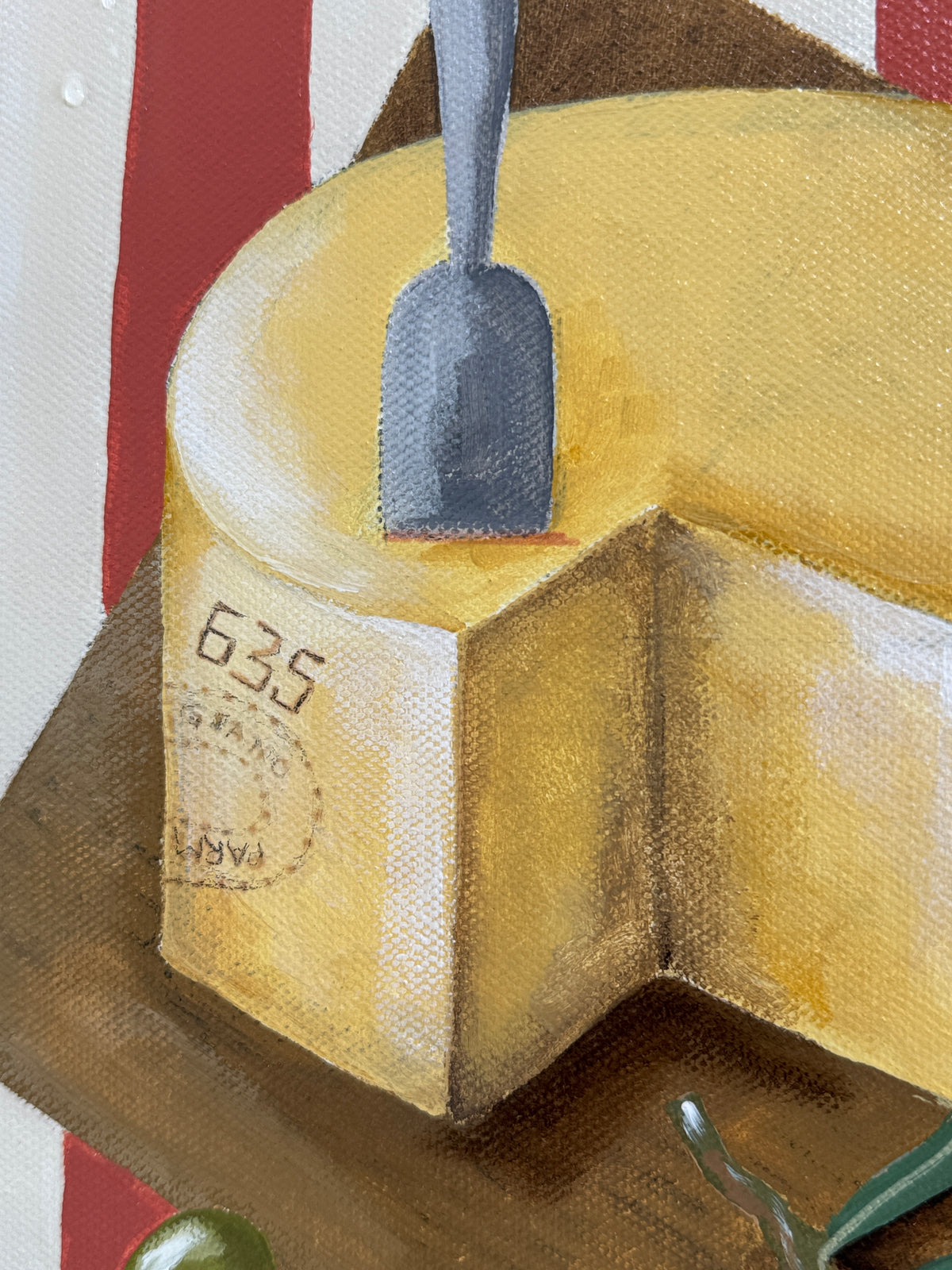 Close-up of a block of cheese with a knife on a wooden board against a colorful background