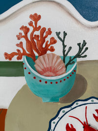 Decorative tile with a teal bowl containing coral and a shell on a beige background.