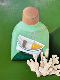 Decorative wall art with a bottle containing a toy boat on a green background